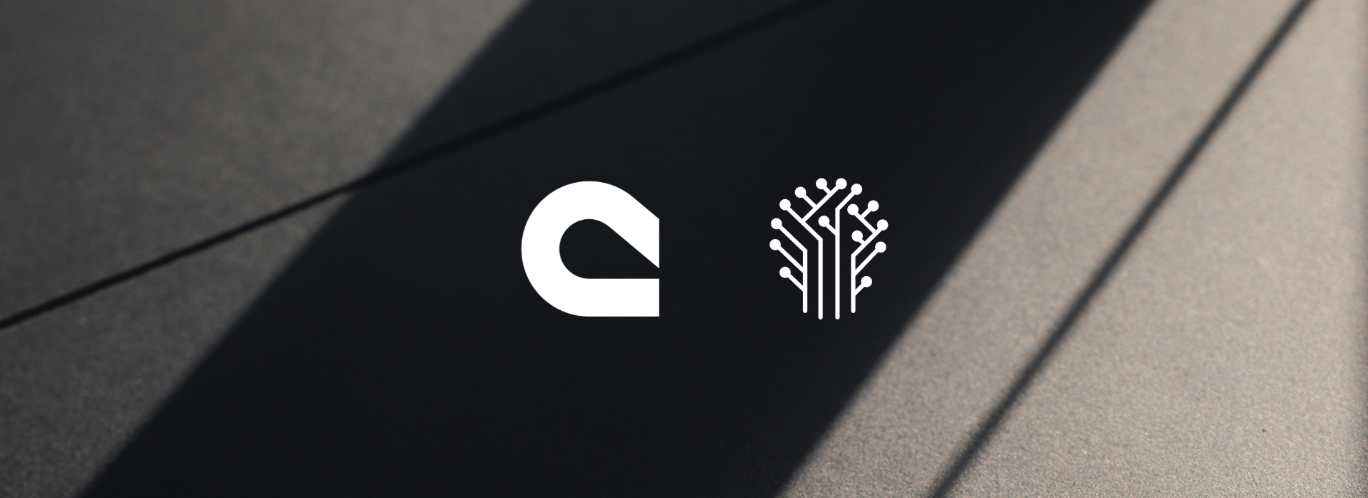 Curamando's and Etals' logos on dark background